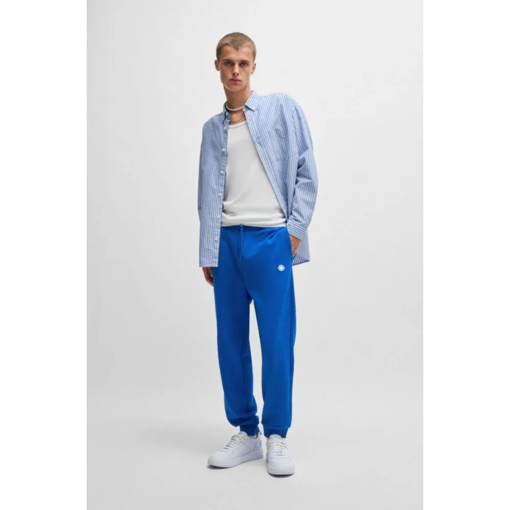 Baumwoll-Frottee-Jogginghose mit Happy-HUGO-Logo-Patch