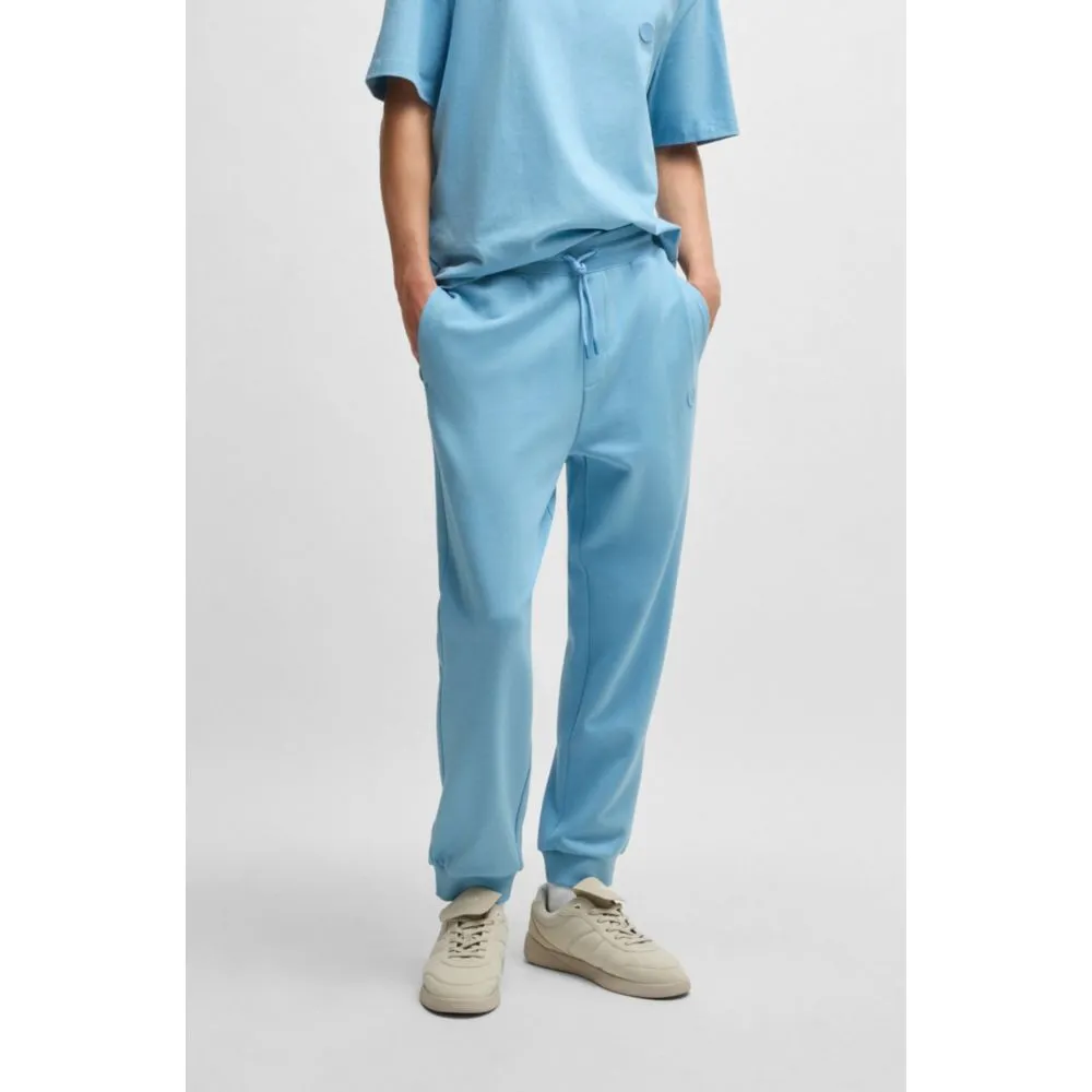 Baumwoll-Frottee-Jogginghose mit Happy-HUGO-Logo-Patch