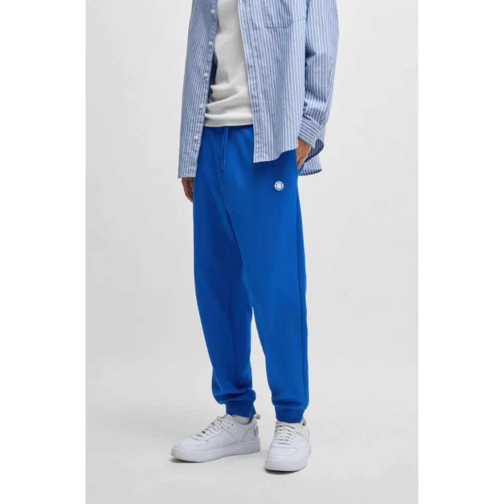 Baumwoll-Frottee-Jogginghose mit Happy-HUGO-Logo-Patch