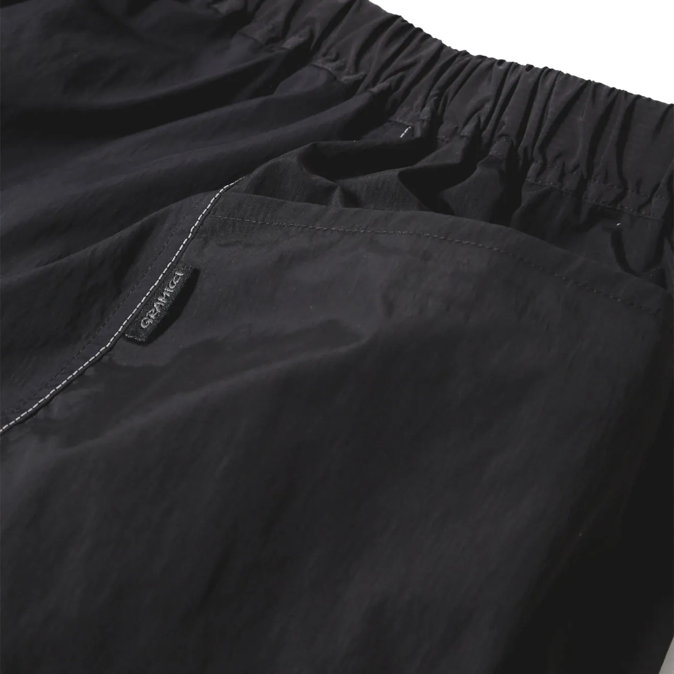 Gramicci x And Wander Patchwork Wind Short Schwarz