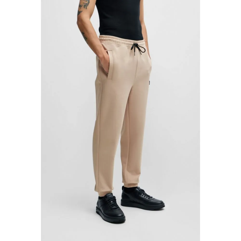 Stretch-Baumwoll-Jogginghose mit gestapeltem Logo